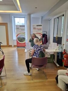 Louise greeting attendees
